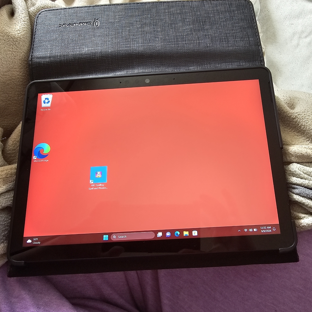 On Running Tablet with Black Textured Folio and Red Display Screen